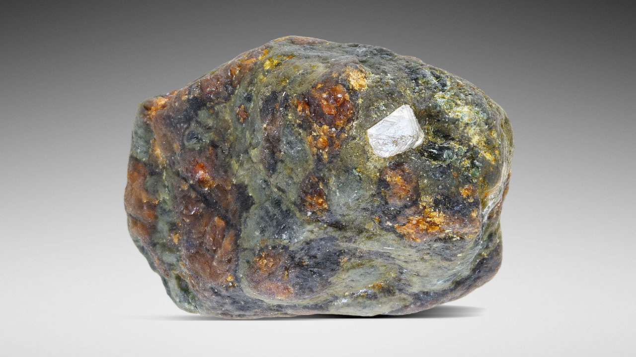 A mottled green and copper-colored mineral.