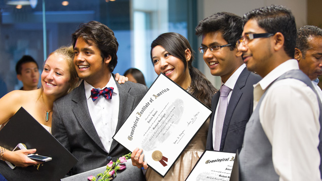 Students proudly show their GIA diplomas at graduation