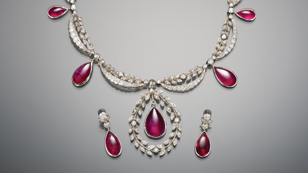 A stunning red bejeweled necklace and pair of earrings