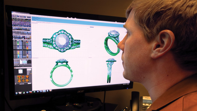 A man designs rings with a 3D modelling software